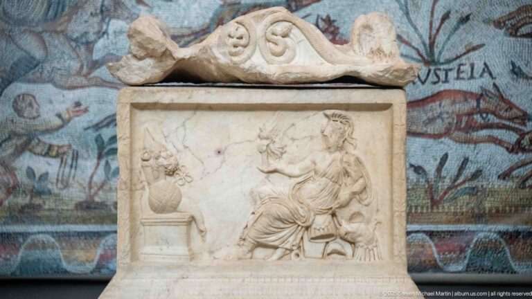 Marble relief from the Mahdia shipwreck showing an offering to Asclepius and Hygieia beside a small altar.