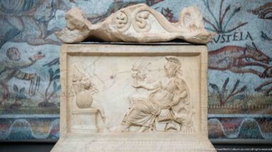 Marble relief from the Mahdia shipwreck showing an offering to Asclepius and Hygieia beside a small altar.