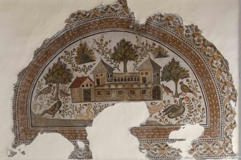 Semicircular Roman mosaic with a country villa surrounded by trees, plants, and large birds, with losses across the lower section.