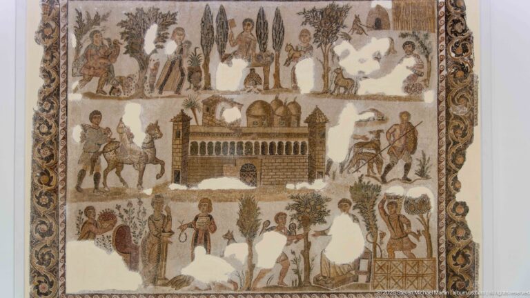 Mosaic of the Lord Julius with a central fortified villa surrounded by estate workers, riders, trees, animals, and seasonal activities.