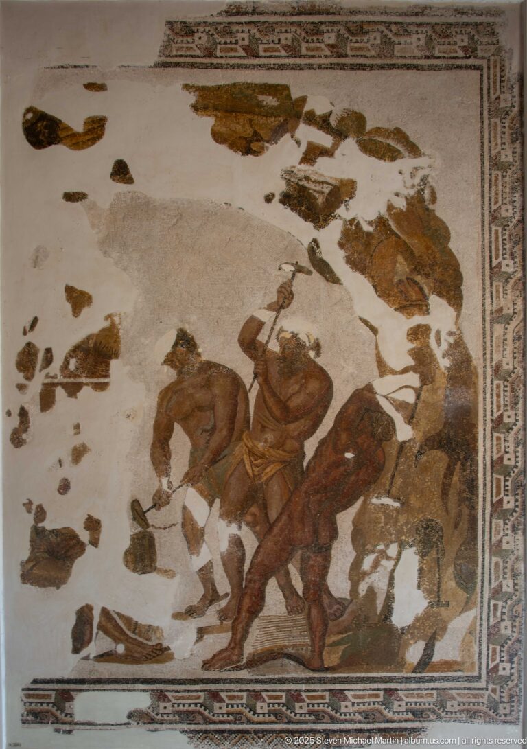 Fragmentary Roman hunting mosaic with mounted hunters, horses, large game animals, geometric border, and extensive white losses.