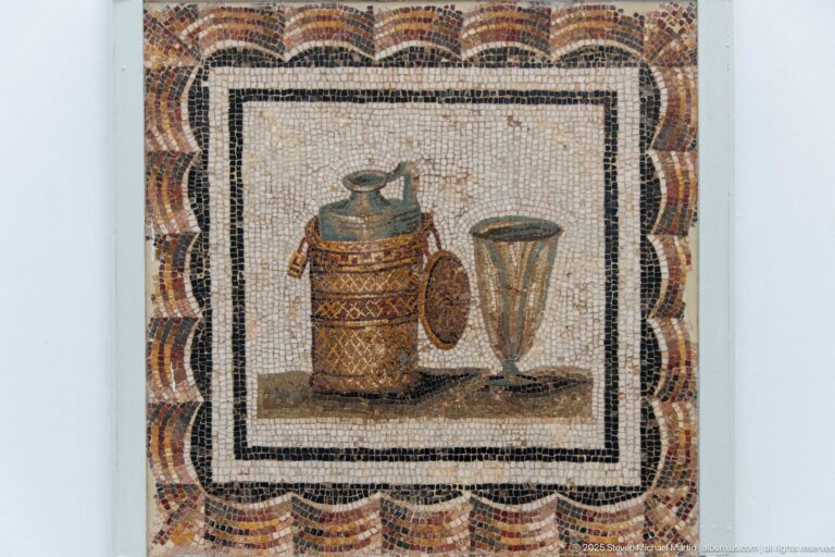 Decorated cylindrical container, small jug, and tall flaring vessel arranged as a Roman mosaic still life.