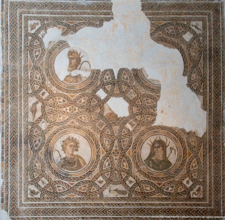 Fragmentary Roman mosaic with three portrait busts in circular medallions surrounded by dense interlaced geometric ornament.