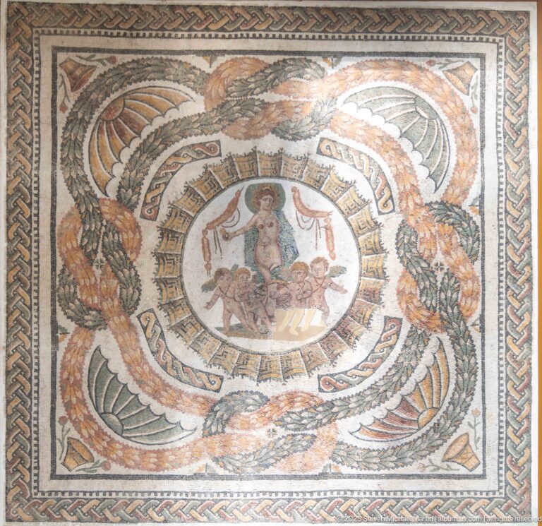 Roman mosaic with a central woman and children, surrounded by concentric bands, large birds, foliage, and braided border.