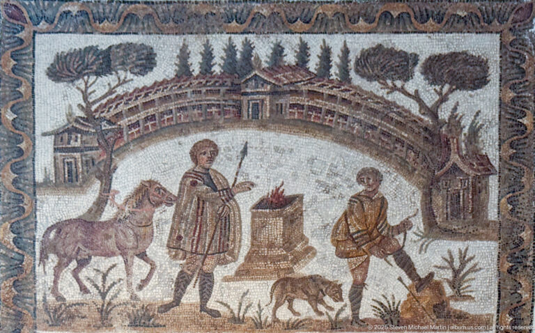 Two men with animals and a raised altar or brazier before large estate buildings in a Roman landscape mosaic.