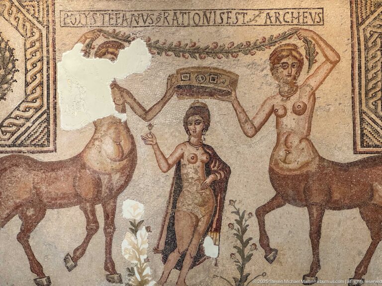 Close view of Venus between two centauresses raising a victory crown above her in the Crowning of Venus mosaic.