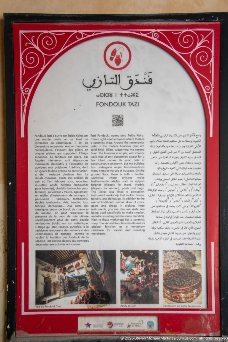 Bilingual “FOOD” information panel with Arabic text and small photographs of market goods and prepared dishes.