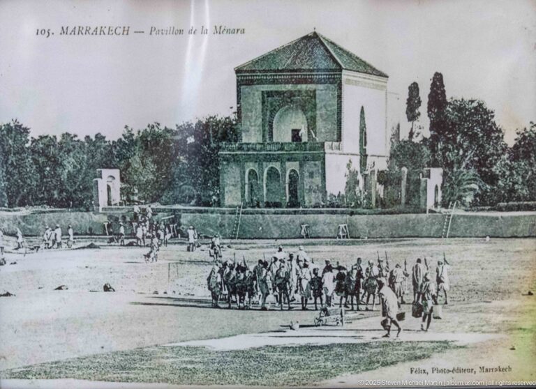 Historic postcard view of the Menara pavilion beside its reflecting basin and gardens in Marrakech.