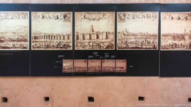 Display of historic engraved panoramas of Marrakech arranged in a row above smaller reproductions.