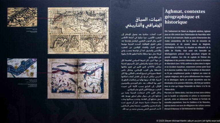 Trilingual interpretive panel titled Aghmat, geographical and historical context, with maps and historical illustrations.