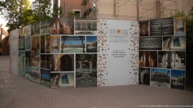 Restoration project display and scaffolding at Bahia Palace, with architectural photographs and Arabic-French project text.