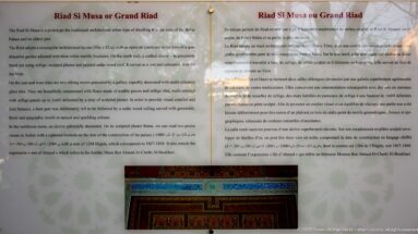 Bahia Palace interpretation panel headed Riad Si Moussa ou Grand Riad with historical text and a detail photograph below.