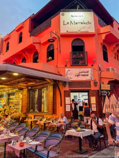 Red Le Marrakchi restaurant façade with outdoor seating and arched windows near Djemaa El Fna.