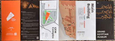 Printed gallery plan sign at the Grand Egyptian Museum, mapping the main collection galleries for visitors.