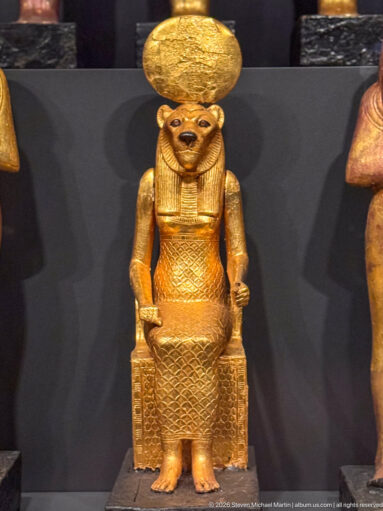 Late Period bronze statuette of the lioness-headed goddess Wadjet seated on a throne, from Sais in the western Nile Delta.