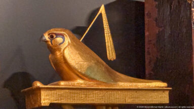 Small Graeco-Roman gilt silver hawk from the Dendera Treasure Hoards, with incised plumage and a hooked beak.