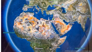 Wide in-flight map of Africa, Europe, and the Middle East with the aircraft route converging near Amman.