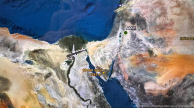 In-flight map showing Cairo, the Sinai Peninsula, and a route line toward Amman marked AMM in Jordan.