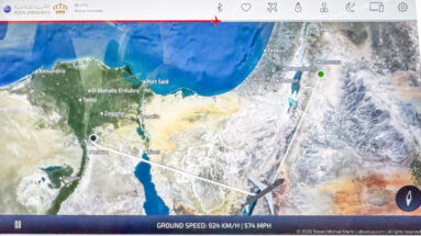 In-flight map showing an aircraft route over Egypt toward the eastern Mediterranean, with Cairo and Port Said labeled.