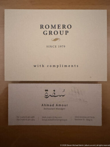 Romero Group card above a business card naming restaurant manager Ahmad Amour in Amman.