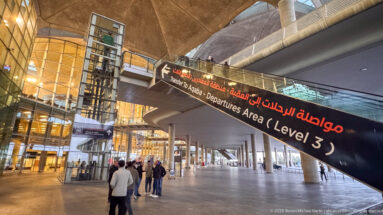 Arabic-and-English sign points to the Level 3 departures area inside Queen Alia International Airport.
