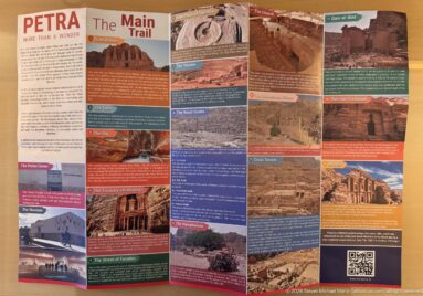 Petra Main Trail information panel with photographs, monument descriptions, maps, and colored text blocks.