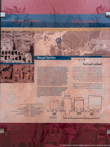 Royal Tombs interpretive panel with photographs, site map, bilingual text, and drawn elevation of tomb façades.