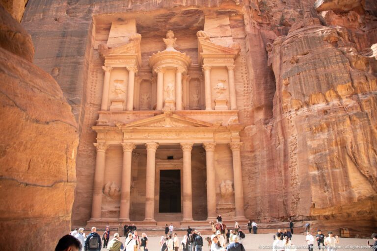 Visitors gathered below the full rock-cut façade of Al-Khazneh, Petra’s Treasury, at the end of the Siq.