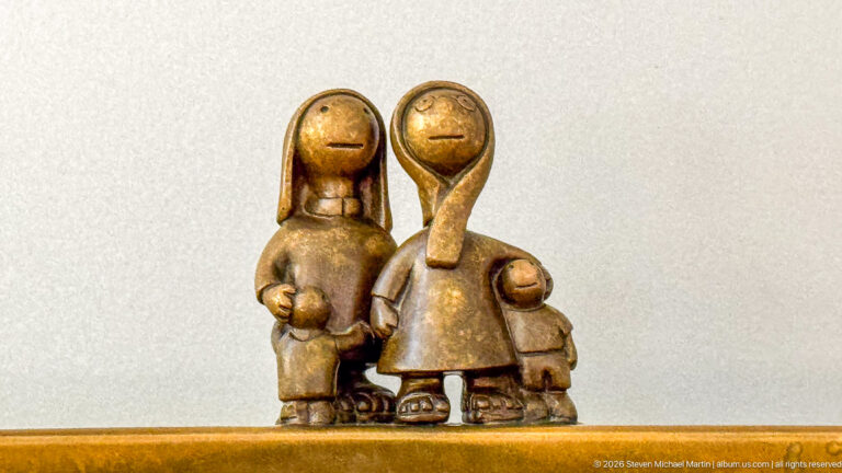 Close view of stylized bronze adults and children in Tom Otterness’s Other Worlds at Hamad International Airport.