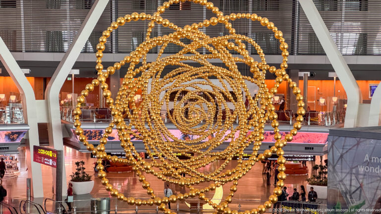 Jean-Michel Othoniel’s COSMOS, a large golden globe-like installation inside Hamad International Airport.
