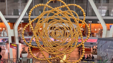 Jean-Michel Othoniel’s COSMOS, a large golden globe-like installation inside Hamad International Airport.