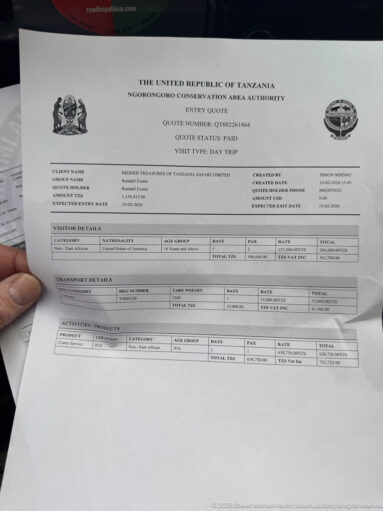 Official Ngorongoro Conservation Area Authority printed form held open by hand, with government heading and boxed administrative fields.