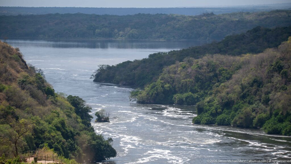 Elevated view of the Victoria Nile winding between steep green banks in Murchison Falls National Park.