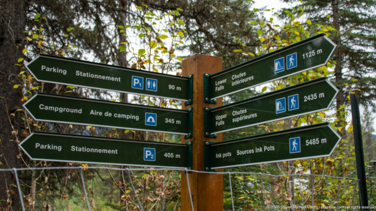 Green arrows give distances to parking, campground, Lower Falls, Upper Falls, and the Ink Pots.
