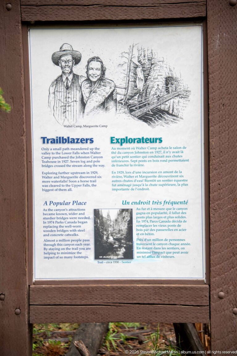 Bilingual “Trailblazers” sign includes drawings and text about early exploration and visitation.
