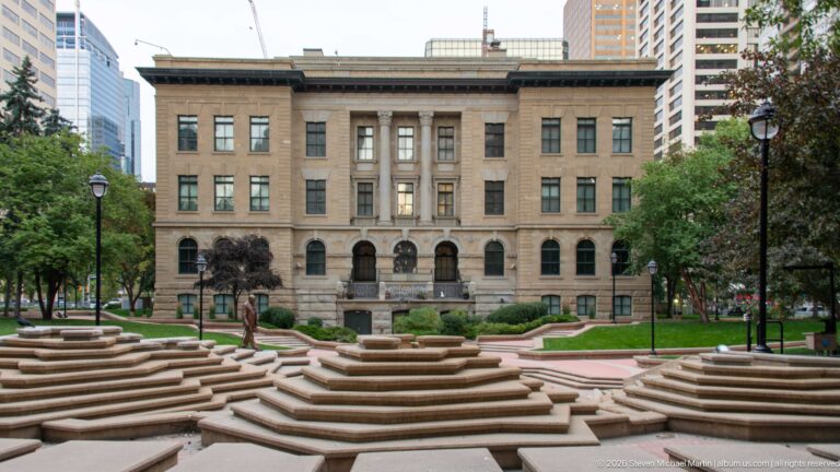 McDougall Centre’s symmetrical sandstone façade behind the terraced steps and landscaping of Harley Hotchkiss Gardens in downtown Calgary.