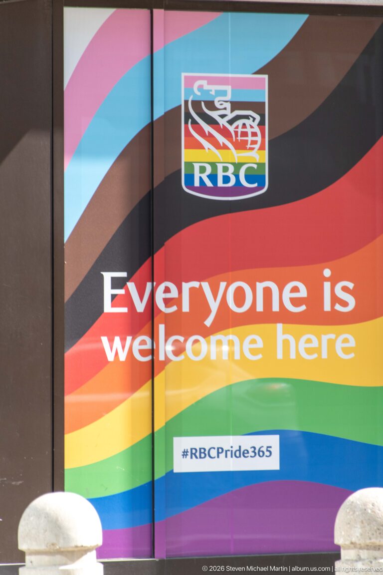RBC window display with rainbow bands, logo, and the words Everyone is welcome here and #RBCPride365.