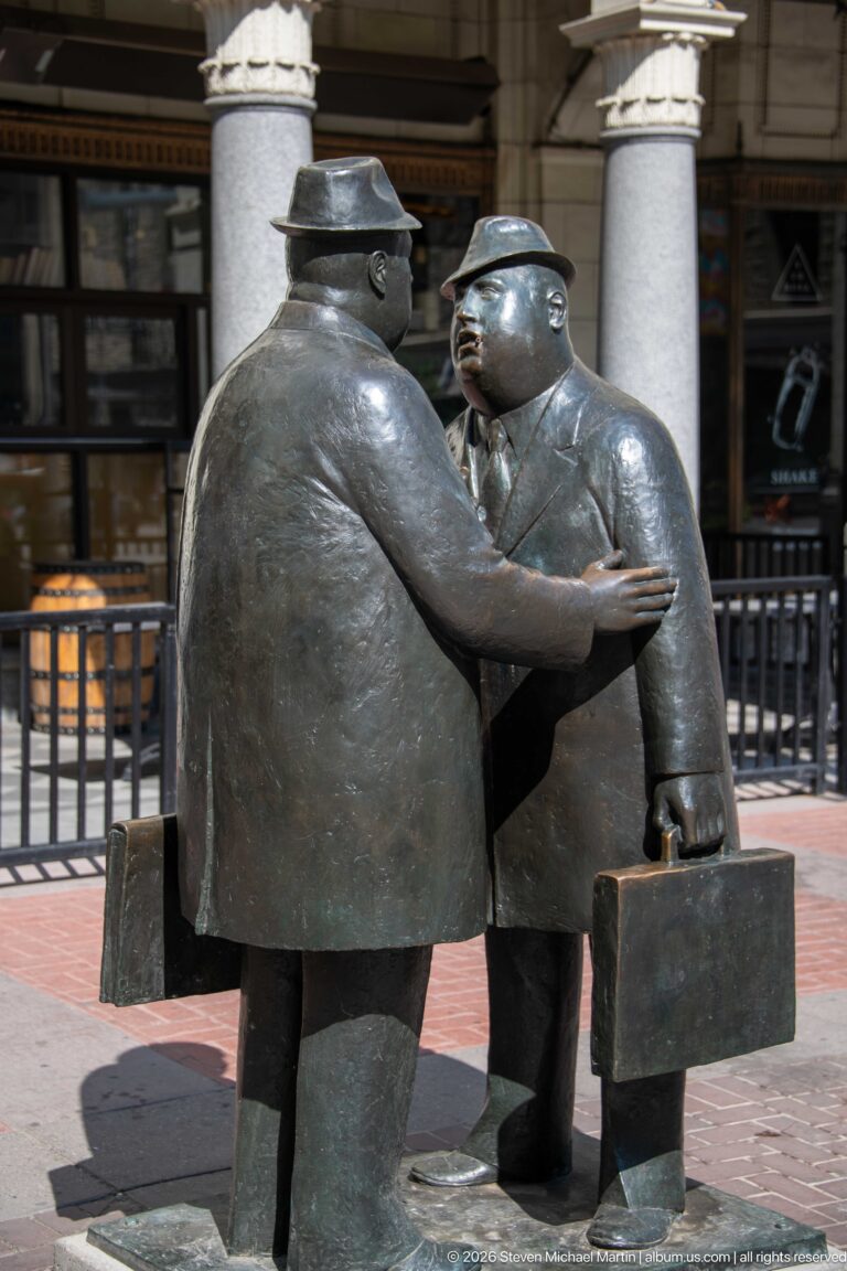 William Hodd McElcheran’s bronze Conversation sculpture showing two businessmen facing one another on Stephen Avenue.