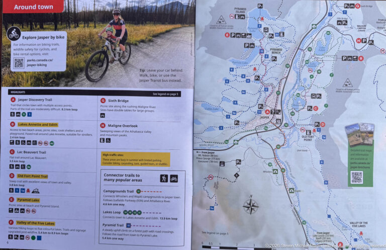 Jasper town guide with cyclist photograph, trail listings, visitor symbols, and a detailed street and path map.