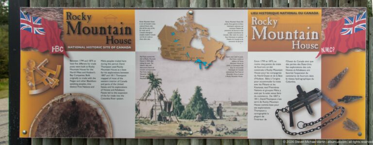 Bilingual Rocky Mountain House history panel with maps, archival scene, company references, and illustrations of trade objects.