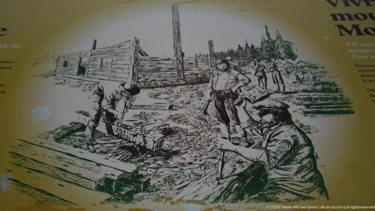 Black-and-white interpretive drawing of several men handling heavy timber beside a rough log building.
