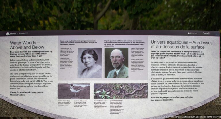 Bilingual “Water Worlds” exhibit panel with portraits and images of aquatic species and habitats.