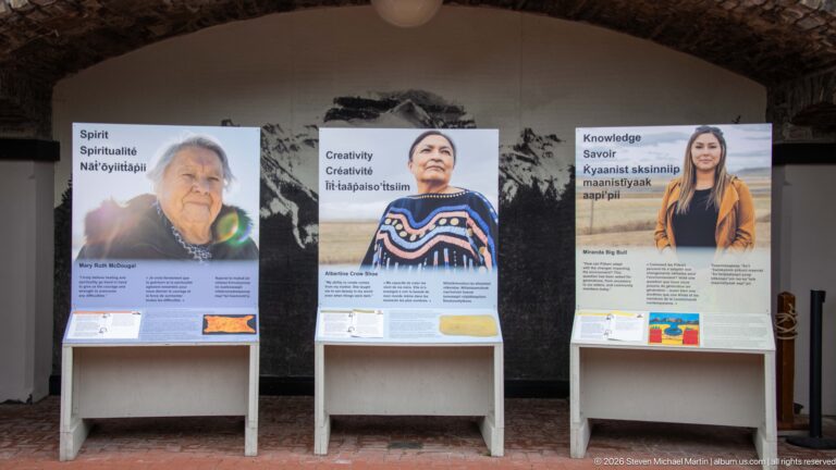 Three panels headed Spirit, Creativity, and Knowledge present Indigenous voices beneath a stone arch.