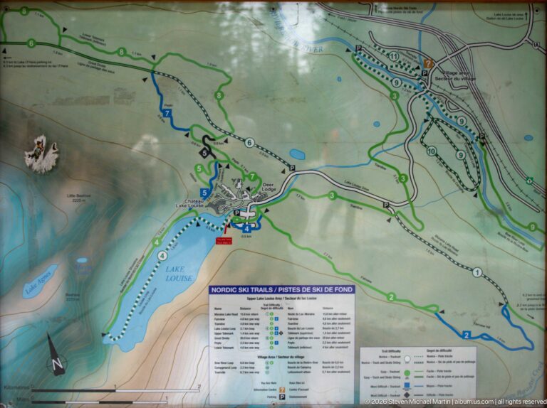 A large map marks Lake Louise, roads, and colored hiking and Nordic ski routes.