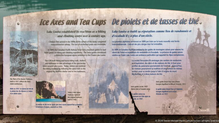 A bilingual sign titled “Hikes and Tea Cups” explains Lake Louise hiking and climbing history.