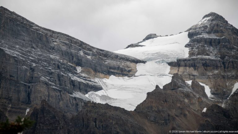 Victoria Glacier fills a rocky mountain basin, its broken white ice framed by dark cliffs.