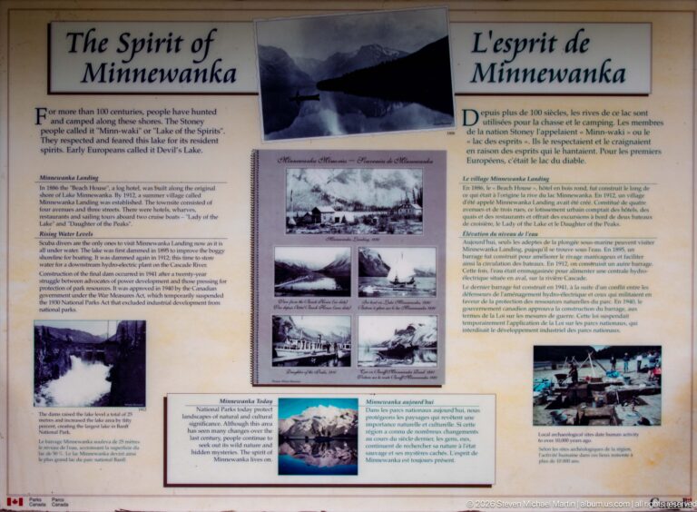 Bilingual Spirit of Minnewanka interpretive panel with historic photographs and explanatory text.
