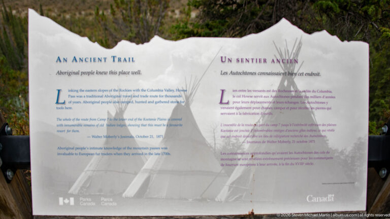 Bilingual “An Ancient Trail” interpretive panel with a large tipi image and text about Indigenous travel.