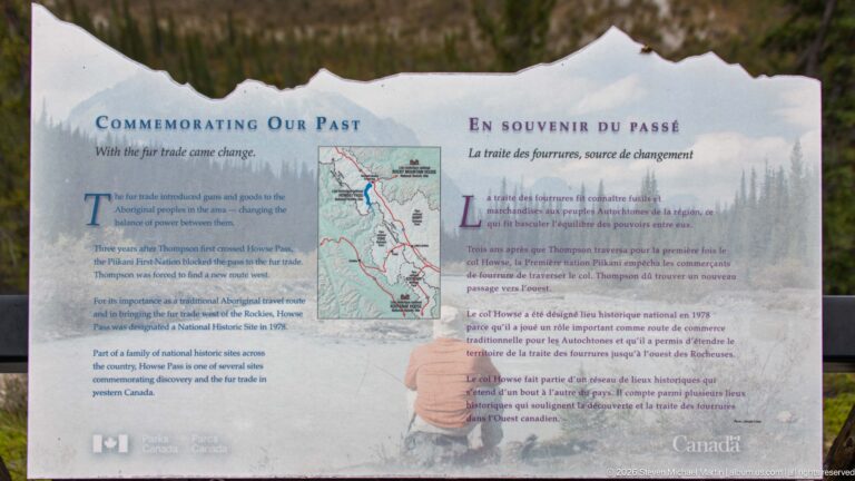 Bilingual “Commemorating Our Past” interpretive panel with a route map and historic imagery.