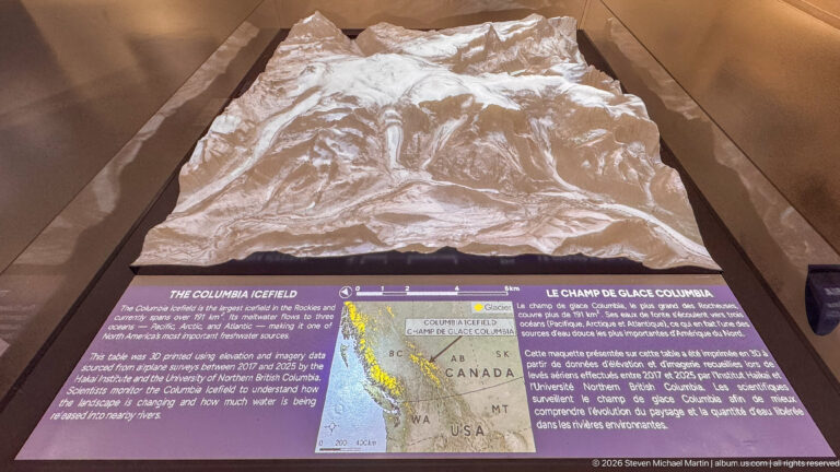 Raised topographic model of the Columbia Icefield above a bilingual interpretive panel and locator map.